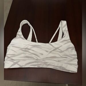 Athleta Exhale sports bra in a white and gray zebra print. Size S
